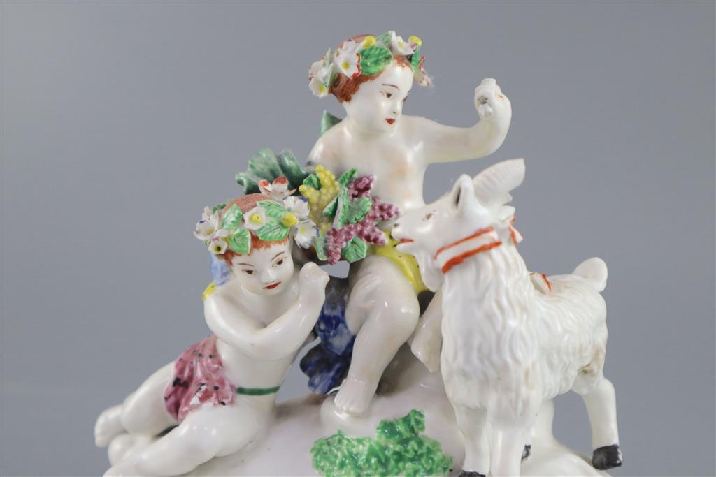 A Vauxhall porcelain group of two Bacchanalian cherubs and a goat, c.1760-5, 14.5cm high
